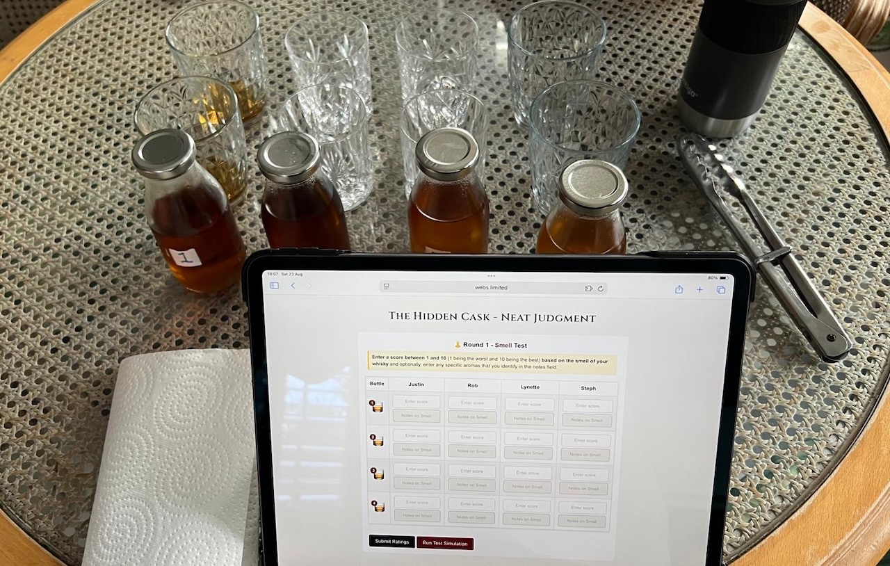 Numbered blind tasting bottles and glasses prepared for whisky scoring